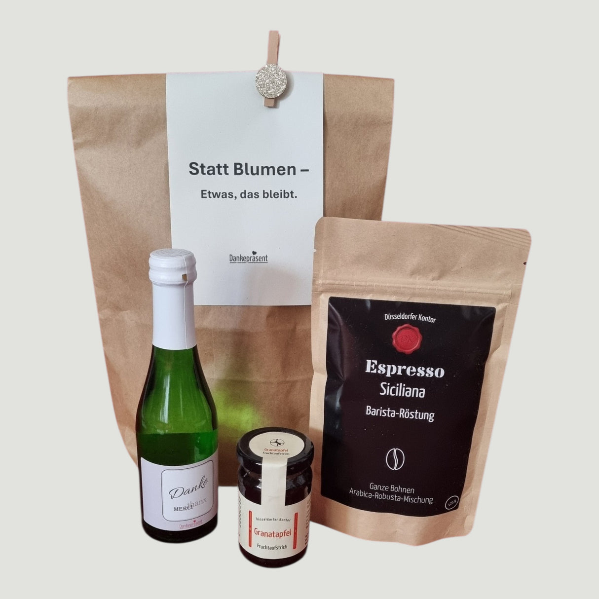 Statt Blumen Genusstüte mit Espresso, Danke-Sekt und Fruchtaufstrich Granatapfel – Wundertüte Dankepräsent Düsseldorf.