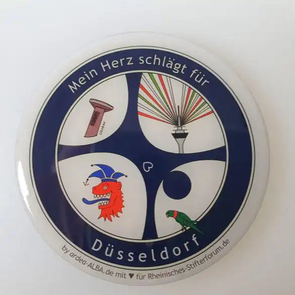 Edler Radschläger-Magnet mit Doming-Effekt "Mein Herz schlägt für Düsseldorf" mit dem markanten Radschläger, dem bergischen Löwen und dem illuminierten Fernsehturm samt frechem Halsbandsittich - mehr Düsseldorf geht nicht!  Düsseldorfer Kontor ❤️ mit Dankepräsent