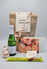 B2B-Wundertüte von Dankepräsent zum Geburtstag mit Sekt mit Danke-Etikett und Grußkarte