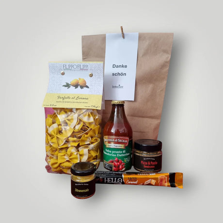 Wundertüte Danke schön als Firmengeschenk – Feinkost-Präsent mit Pasta, Grappa und Gewürzen aus dem Düsseldorfer Kontor von Dankepräsent